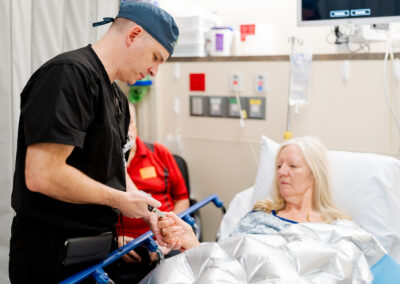 Dr. Turner examining patient's thumb